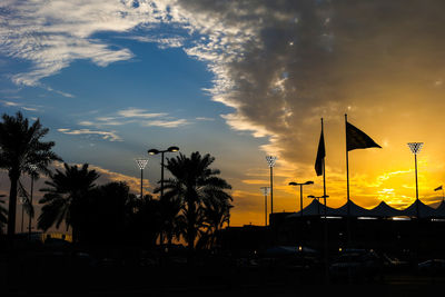 Silhouette trees against sky during sunset