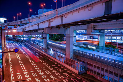 Illuminated bridge at night