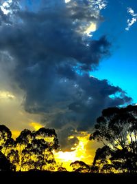 Low angle view of dramatic sky during sunset