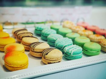 Close-up of colorful macaroons on tray