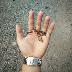 High angle view of person hand on street