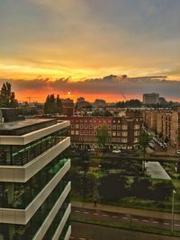 High angle view of cityscape against sky during sunset