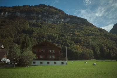 Scenic view of trees and mountains against sky