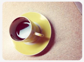 Directly above shot of coffee cup on table