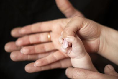 Cropped hands of woman showing nail polish