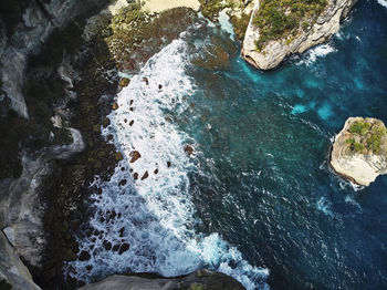 High angle view of rocks in sea