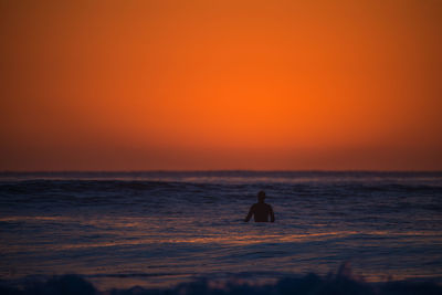 Scenic view of sea at sunset