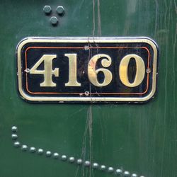Number on green metallic steam engine train