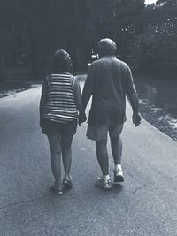 Full length of woman standing on railing