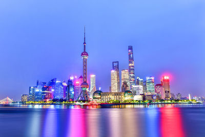 Illuminated buildings in city at night