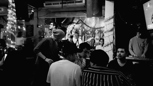 Group of people in market at night