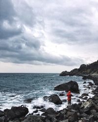 Scenic view of sea against cloudy sky