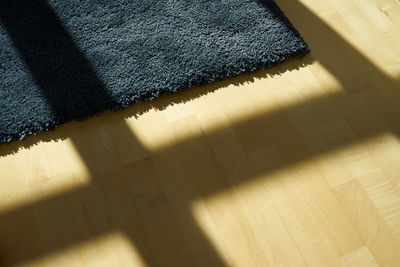 High angle view of shadow on floor at home