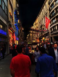 People walking on street at night