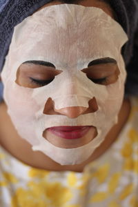 Close-up of woman with facial mask