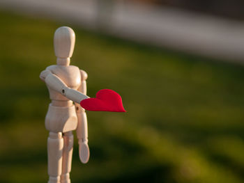 Close-up of stuffed toy on field