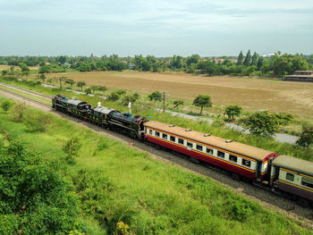 Train on railroad track against sky