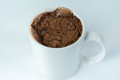 Close-up of coffee cup on table