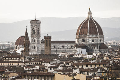 View of buildings in city against sky