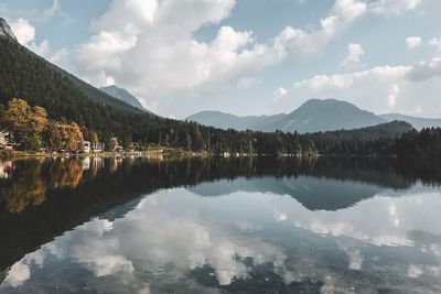 Scenic view of lake and mountains against sky