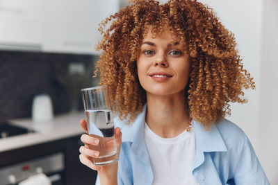 Portrait of young woman using mobile phone