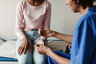 Midsection of woman holding hands