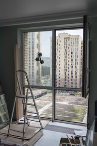 Man seen through glass window of building