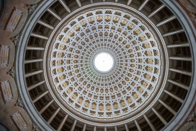 Directly below dome of historic building