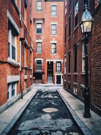 Road amidst residential buildings in city