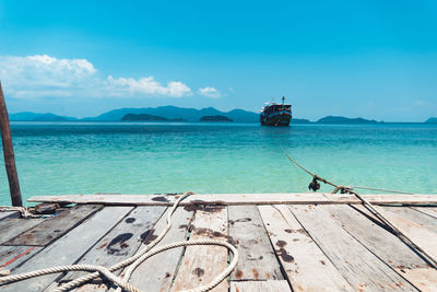 View of pier in sea against sky