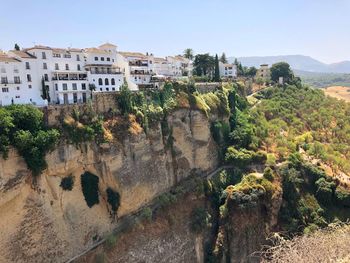 Panoramic shot of buildings against clear sky