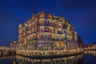 Reflection of buildings in water at night