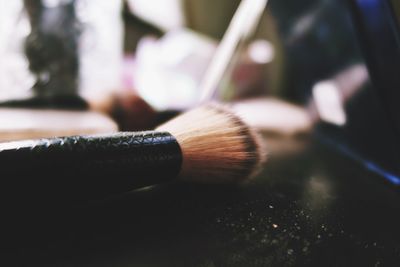 Close-up of make-up brush on table