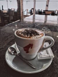 Close-up of coffee cup on table