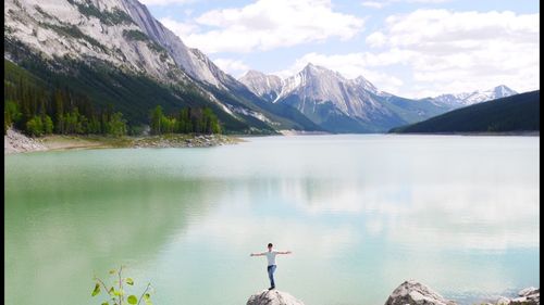 Scenic view of lake and mountains against sky