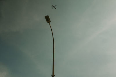 Low angle view of street light against sky