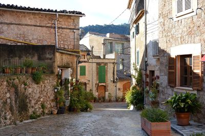 Street amidst buildings in town. old town of valldemossa, majorca, spain.