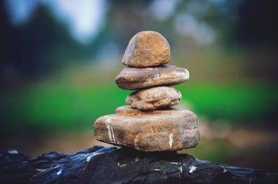 Close-up of balanced stone stack on rock