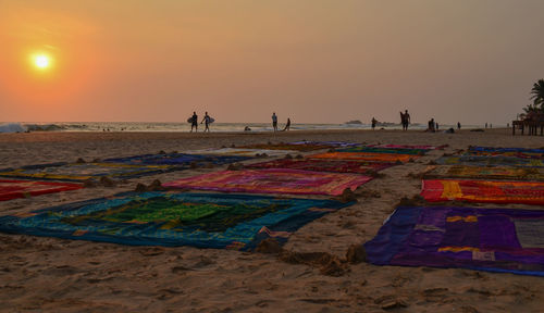 People on beach at sunset