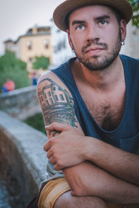 Portrait of tattooed young man
