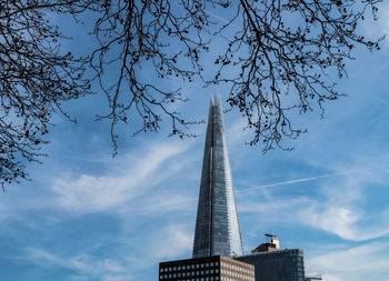 Low angle view of building against cloudy sky