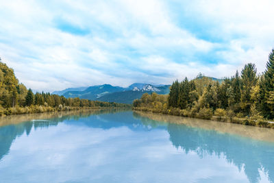 Scenic view of lake and mountains against sky