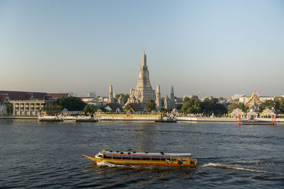 Boats in a temple building against sky