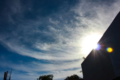 Low angle view of silhouette building against sky during sunset