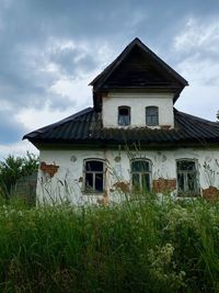 House on field against sky