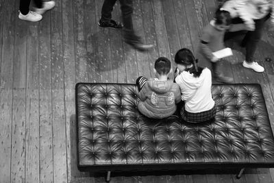 High angle view of people and daughter on table