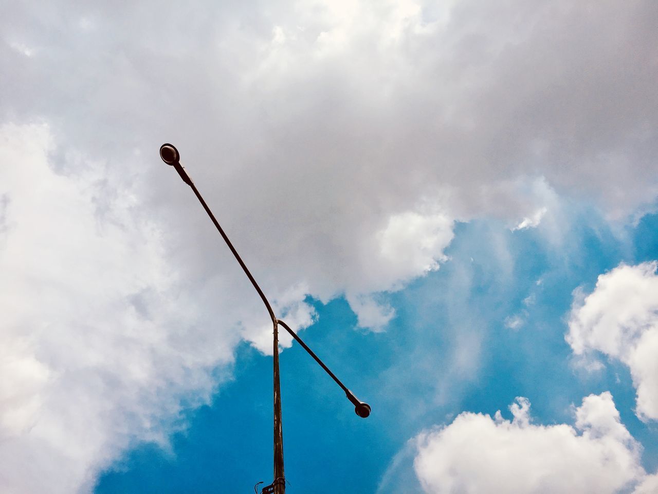 LOW ANGLE VIEW OF STREET LIGHT AGAINST BLUE SKY