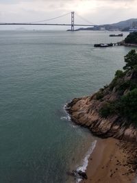 View of suspension bridge over sea