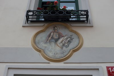 Low angle view of statue against wall in building