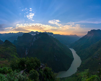 Scenic view of mountains against sky during sunset